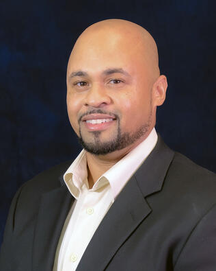 Headshot of Lawrence White