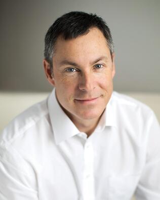Headshot of Trent Baumann