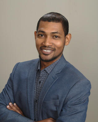 Headshot of Romain Simpson