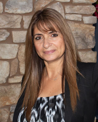 Headshot of Dina Moreno