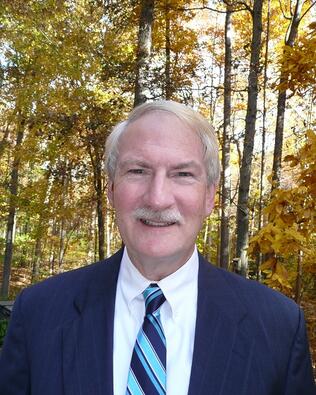 Headshot of John Dewar
