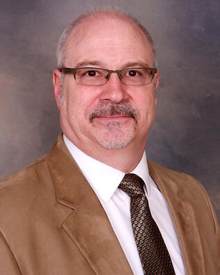 Headshot of Christopher P Nash