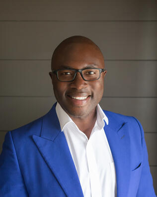 Headshot of Joe Amara-Bangali