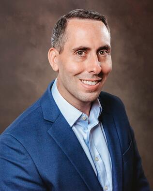 Headshot of Chris Attiliis