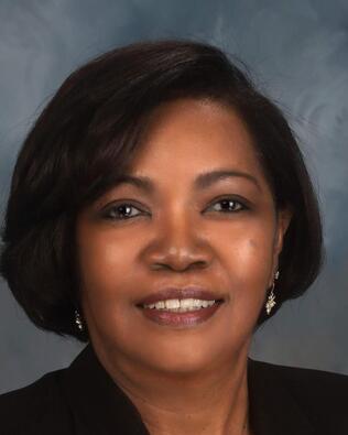 Headshot of KATHY RIGGINS