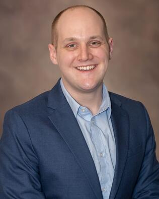 Headshot of Ryan Orange