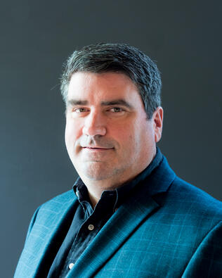 Headshot of John Gill