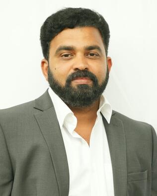 Headshot of Binoy Thomas