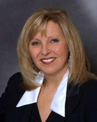Headshot of Savina Deluca