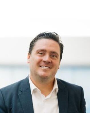 Headshot of Jasen Schrock