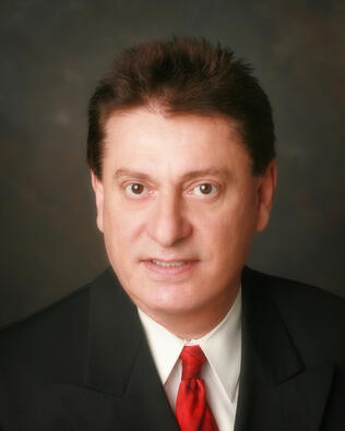 Headshot of Zaki Skaria