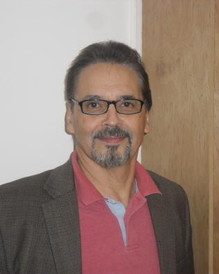 Headshot of J Rivera