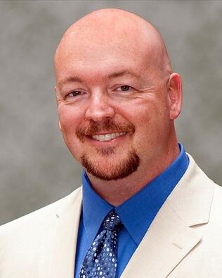 Headshot of Reed Brown