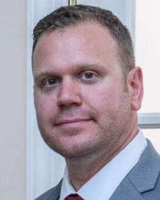 Headshot of Gregory deCharleroy