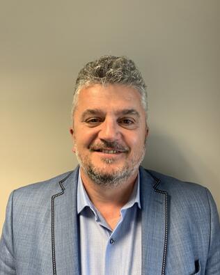 Headshot of William Qirici