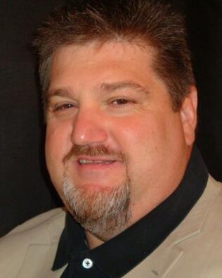 Headshot of John Gurba