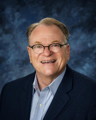 Headshot of Paul White