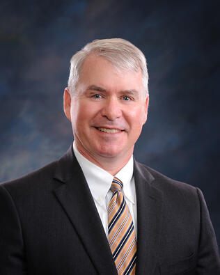 Headshot of Dean Gilbert