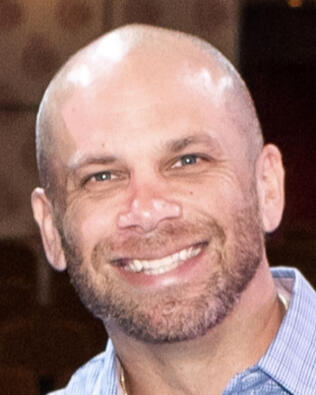 Headshot of Derek Carlson