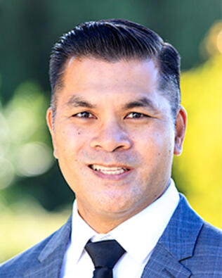 Headshot of Carlos Caluza