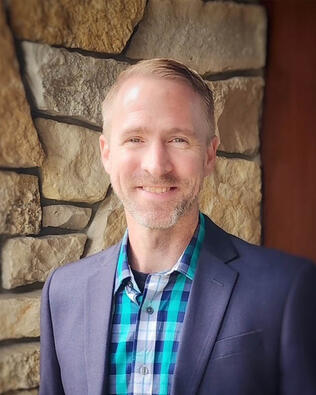 Headshot of Andrew Tirmenstein