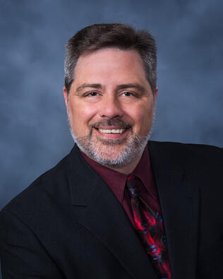 Headshot of Charles Leonard