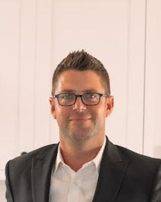 Headshot of Adam Clemens