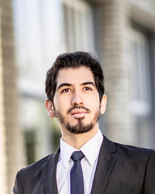 Headshot of CARLOS ROMAN