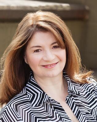 Headshot of Nora Mazonson