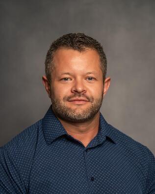 Headshot of Alex McArthur