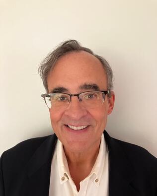 Headshot of John Milne Jr