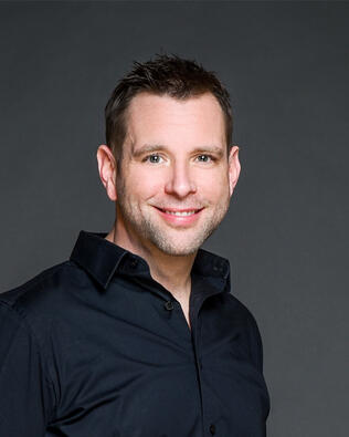 Headshot of Chris Carson