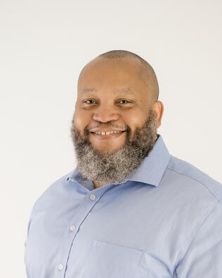 Headshot of Travis Mack