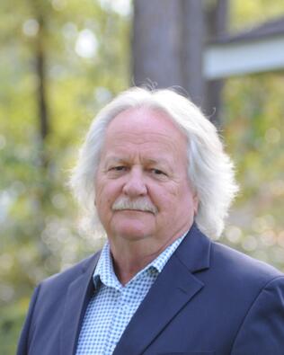 Headshot of JOE P. DYER