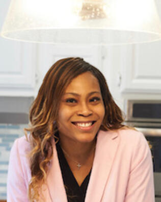 Headshot of Sade Calhoun