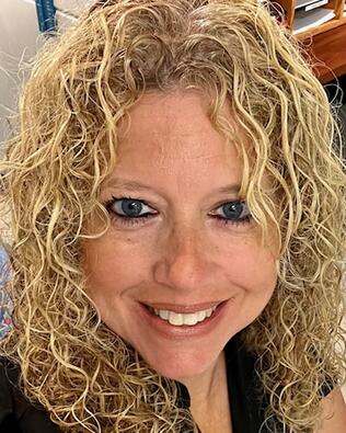 Headshot of Amelia Padalec