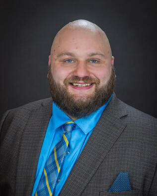 Headshot of Evan Teitelbaum