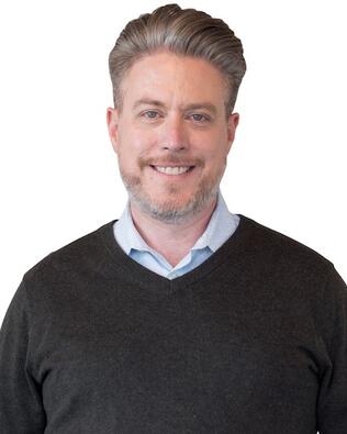 Headshot of Tommy Hartman