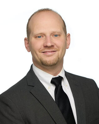 Headshot of Dallan Troyer