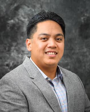 Headshot of Eddie Domingo Jr.