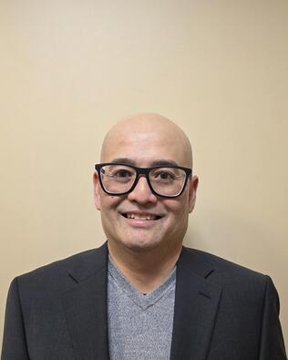 Headshot of Adam Kongtham