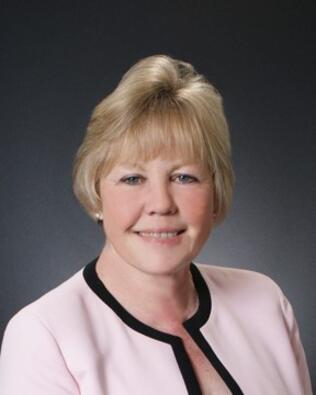 Headshot of Gloria Isaac
