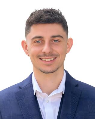 Headshot of Justin Riescher