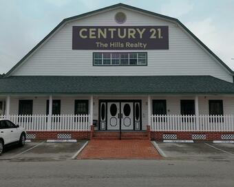 Photo depicting the building for CENTURY 21 The Hills Realty
